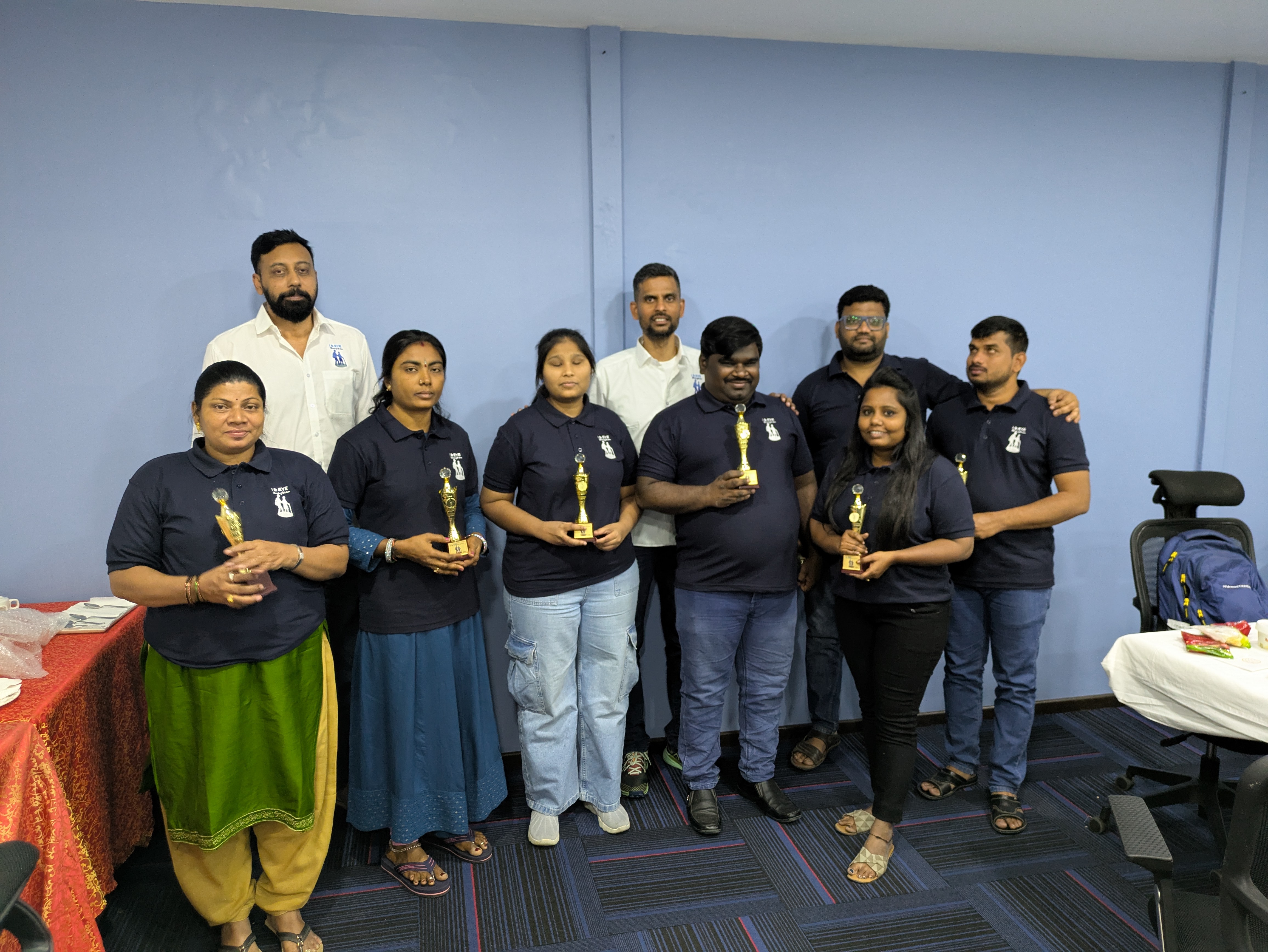 Students in a hands-on training session using tactile learning tools