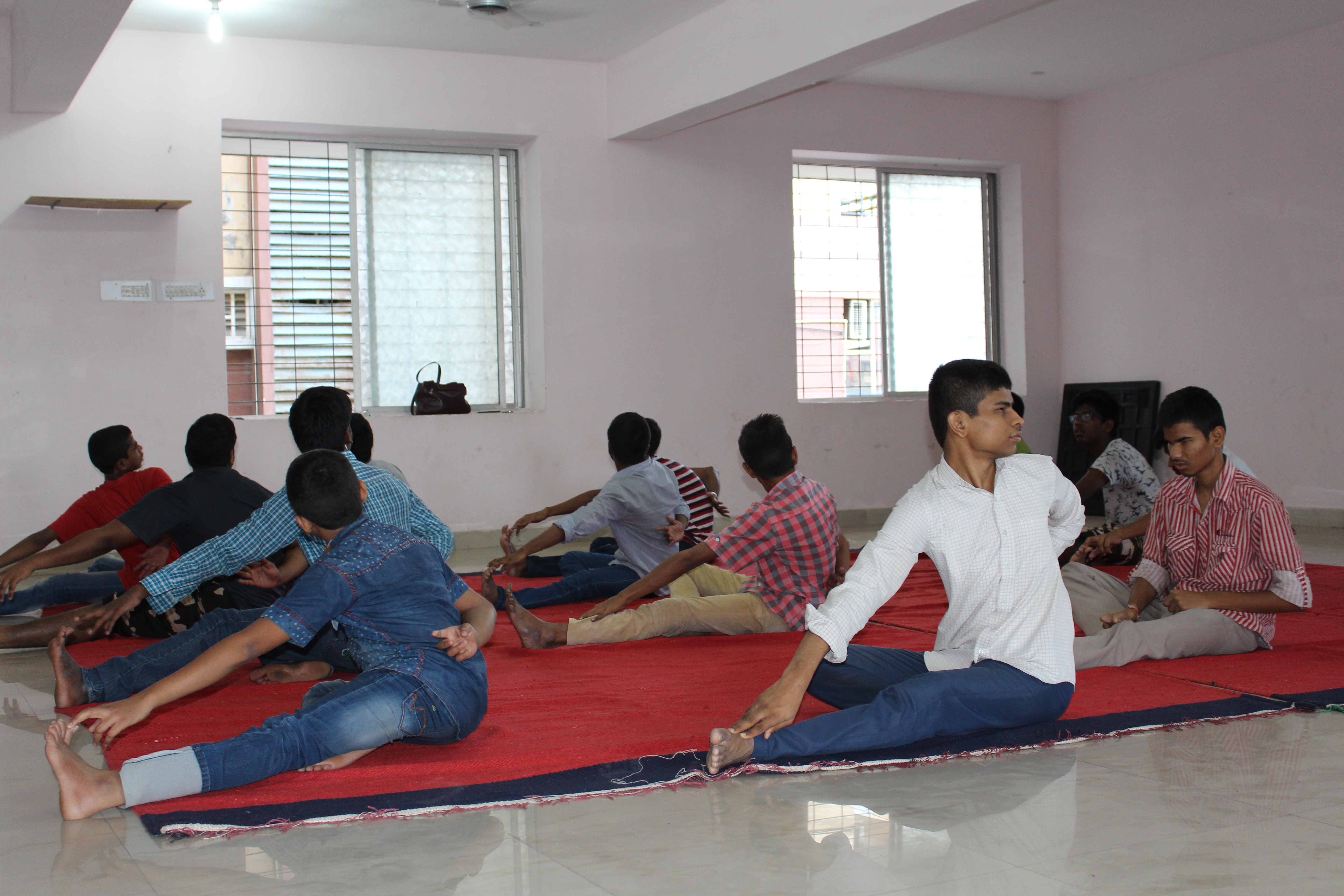 Children participating in yoga as part of the Arogya wellness program
